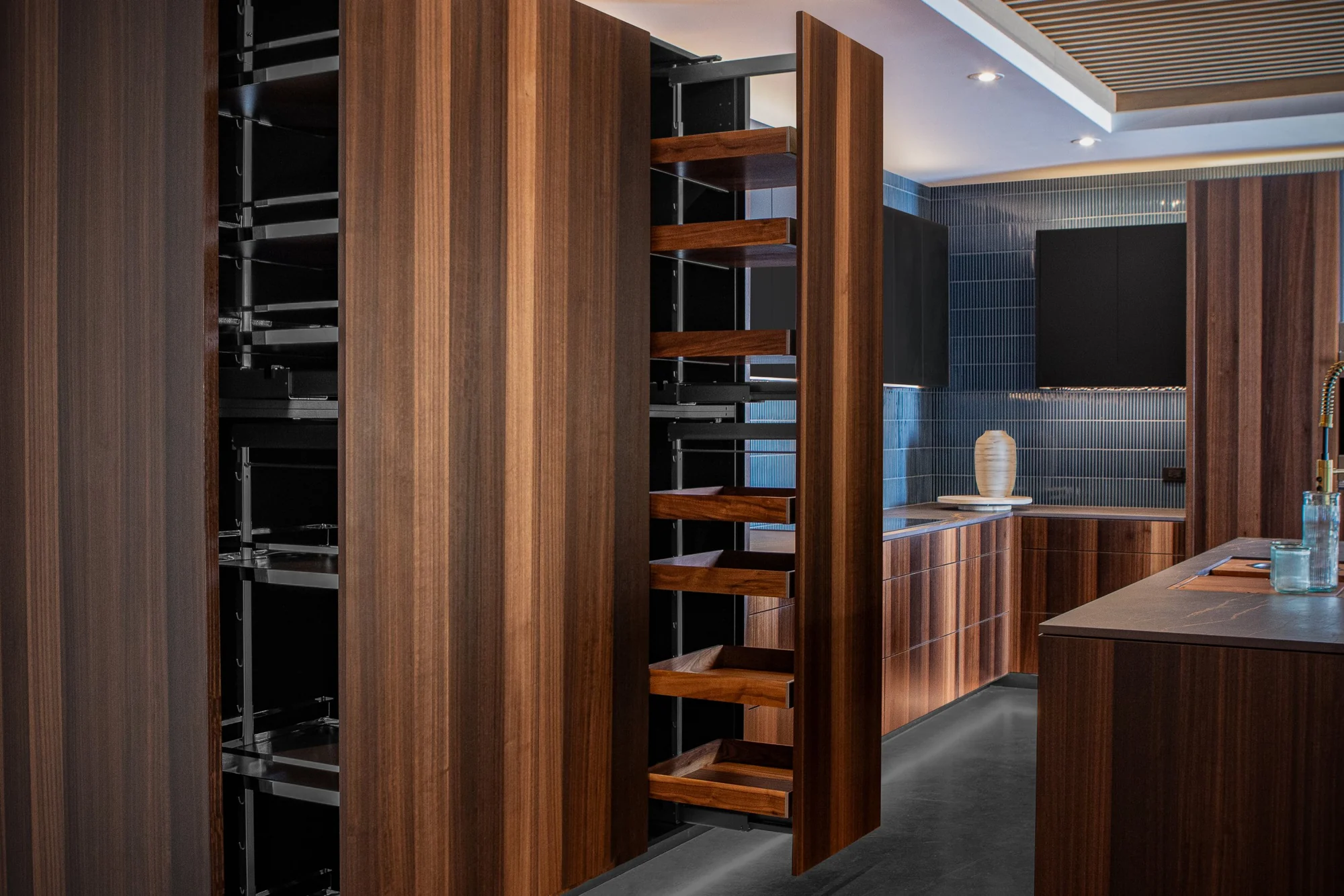 An open integrated pantry in natural wood